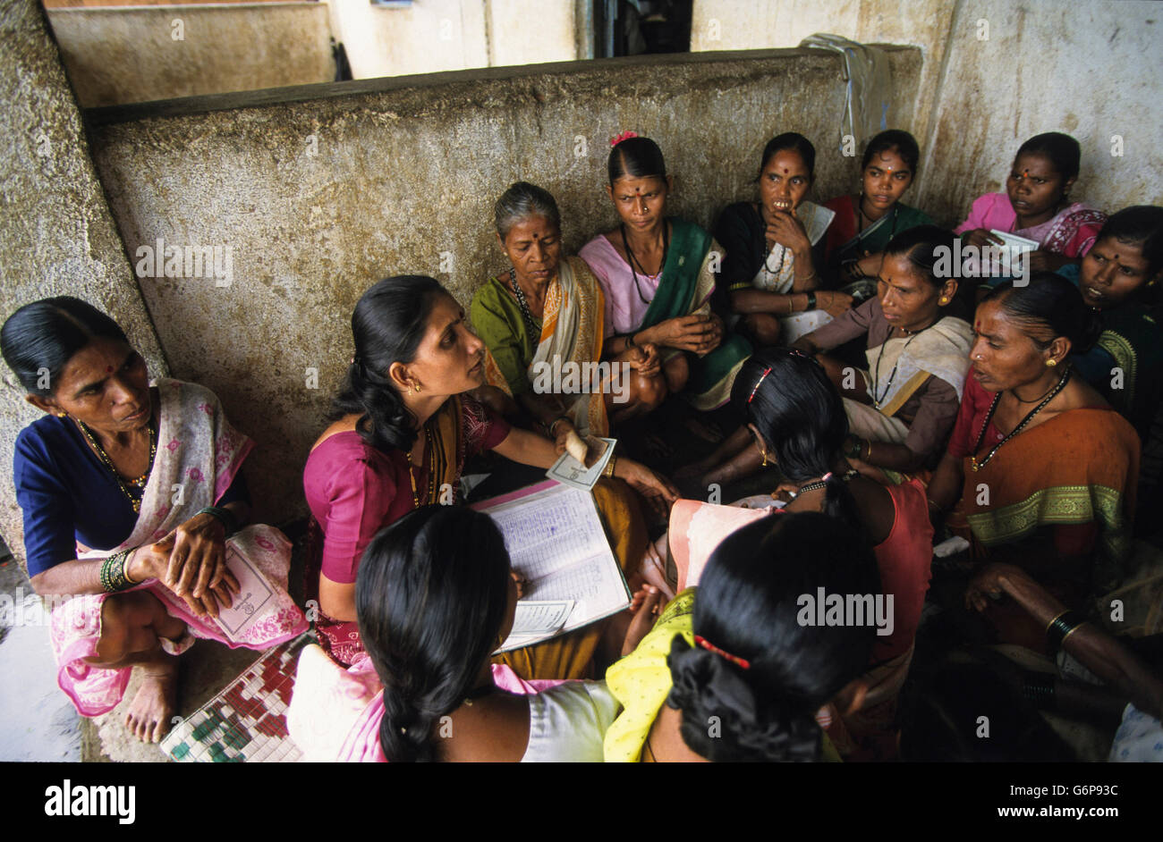 India, rural woman saving bank for dalit women like the Grameen model in village, women save money and can get microcredits finance with low interest rate, empowerment Stock Photo