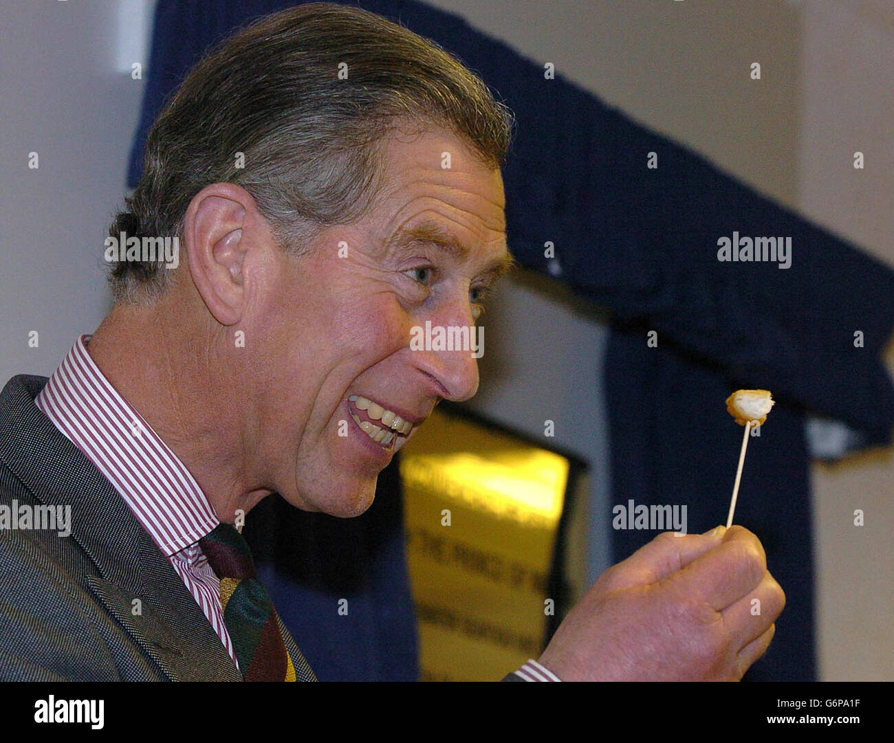 The Prince of Wales samples seafood during his visit to Coldwater Seafood UK in Grimsby, where he is to discuss the environmental, social and economic consequences of overfishing. After seeing the fish factory, his final visit of the two-day tour will be to Lincolnshire Organics at Holme, near Scunthorpe. Stock Photo