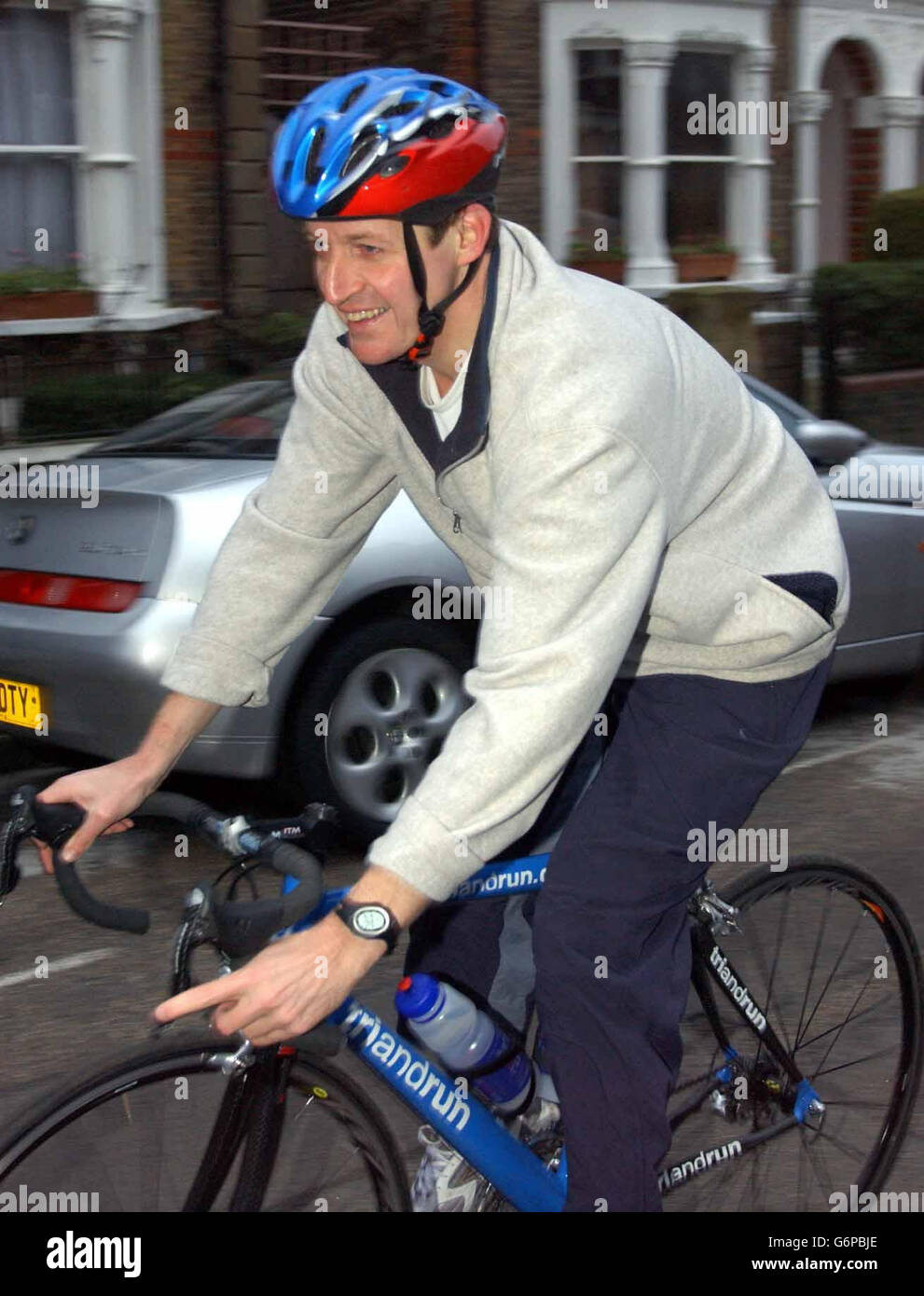 Alastair Campbell, the former Director of Communications to British Prime Minister Tony Blair, arrives at his home in north London, after a bicycle ride. The report by Lord Hutton into events surrounding the death of weapons expert Dr David Kelly will be released to the Government and other parties involved later Tuesday ahead of its formal publication. Stock Photo