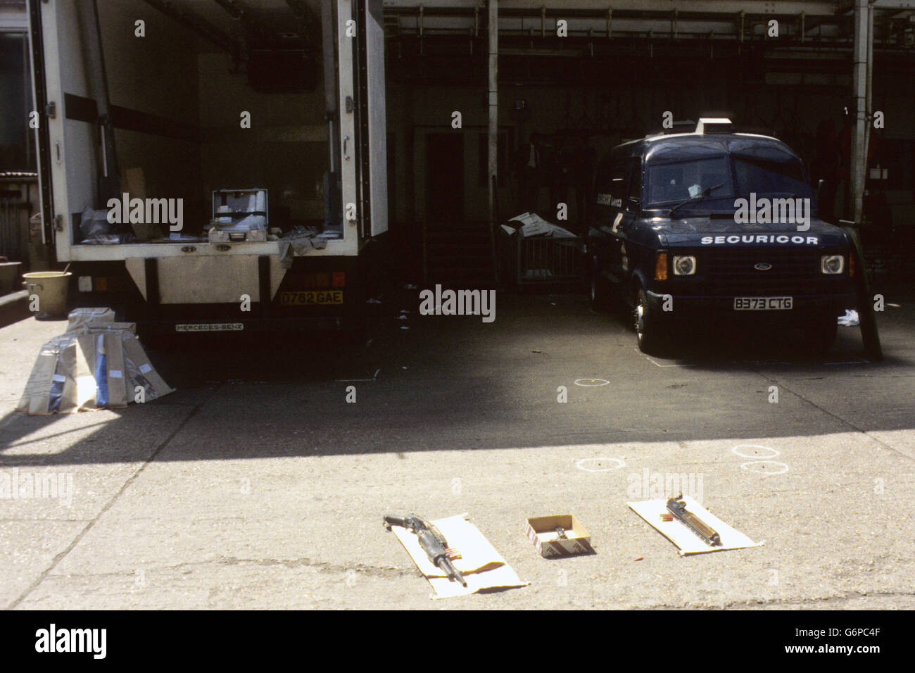 Two pump-action shotguns and three spent cartridge shells marking the site of an attempted robbery at an attempted robbery at an abattoir in Garland Road, Shooter's Hill, London, in which police shot dead two men. Stock Photo