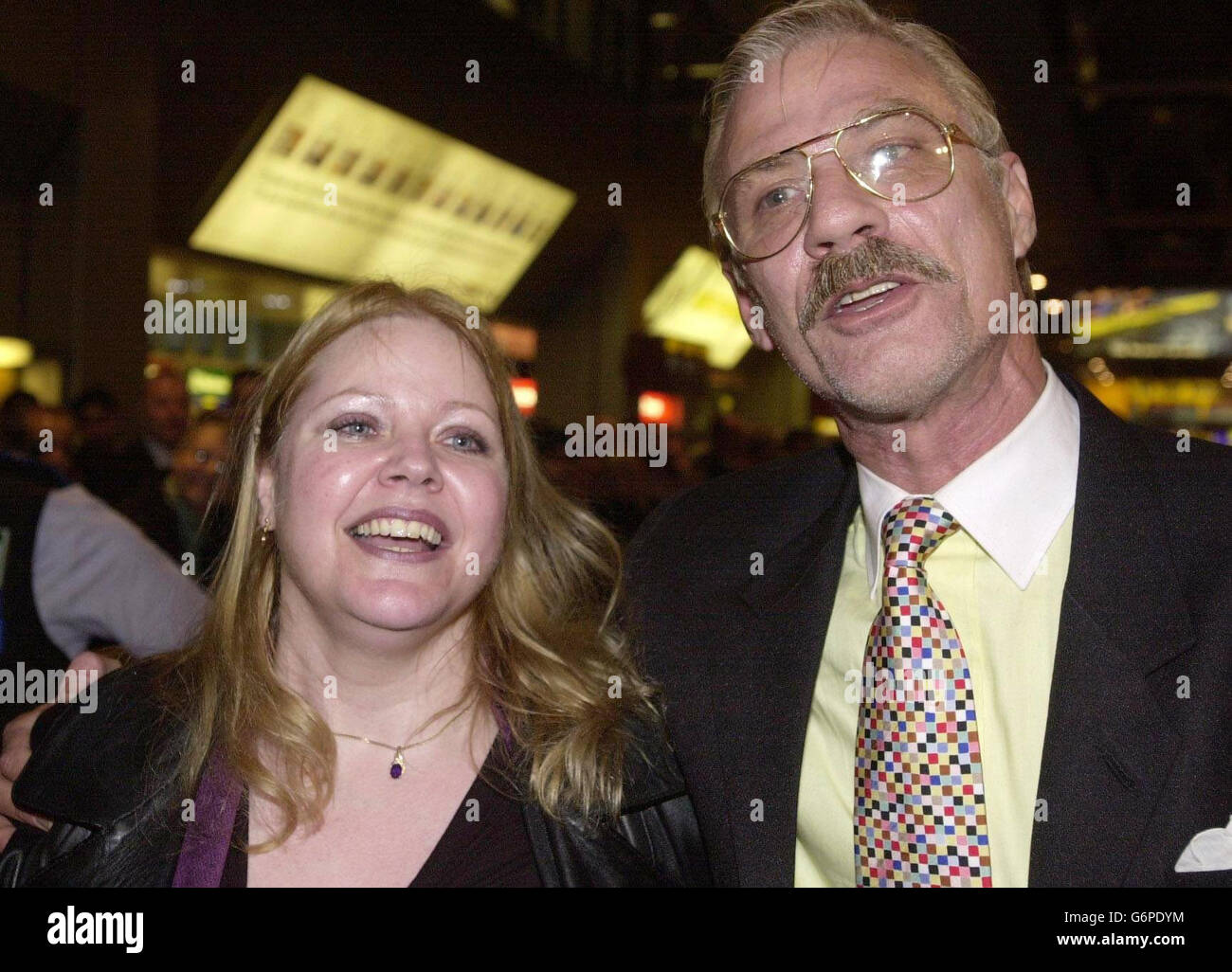 Peter Bleach, who spent eight years in jail in India for his role in an illegal arms drop, stands with his former partner Jo Fletcher after he arrived back at London Heathrow airport. Mr Bleach, who was arrested with five Latvians in December 1995 after a huge consignment of weapons was parachuted into a district in Eastern India, was freed two days ago after high-level intervention by the British Government. Stock Photo