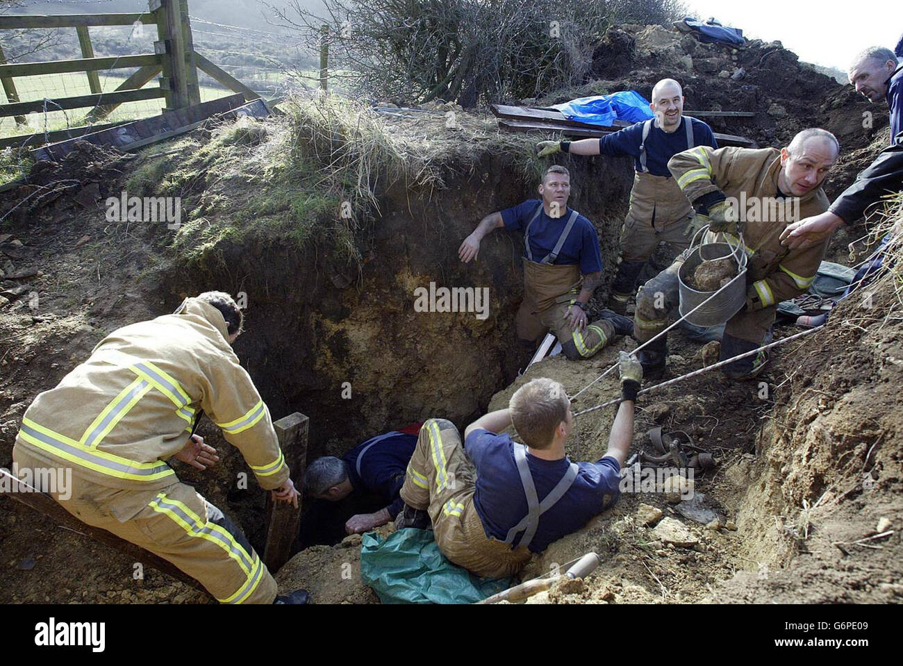 Firemen carefully remove rubble in a bid to rescue Sasha, a 12-week-old Staffordshire bull terrier puppy, after she plunged down a 40ft hole in Old Cassop, near Spennymoor, County Durham. Fire officers were forced to give up the two-day rescue effort after it became to dangerous to continue. Stock Photo
