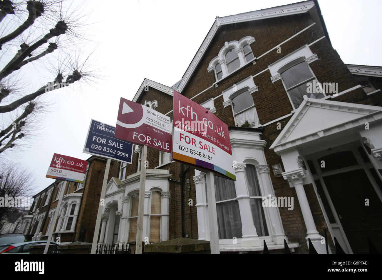 Housing market confidence growing. For Sale signs displayed outside