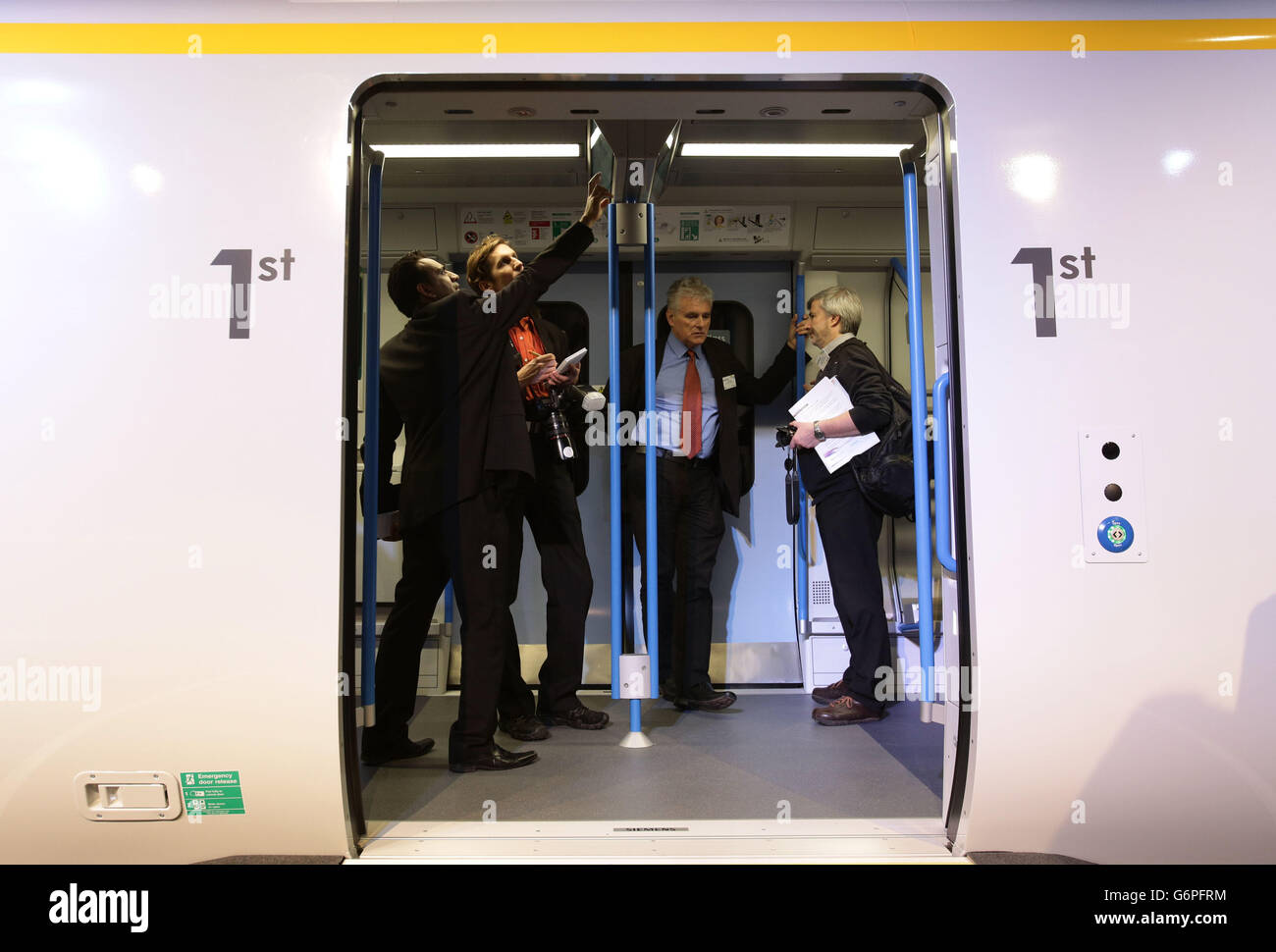 Media on board during the unveiling of a full-scale mock-up of the next-generation Thameslink train - delivered as part of the Government's &pound;6.5bn Thameslink Programme - at ExCeL exhibition centre in London. Stock Photo