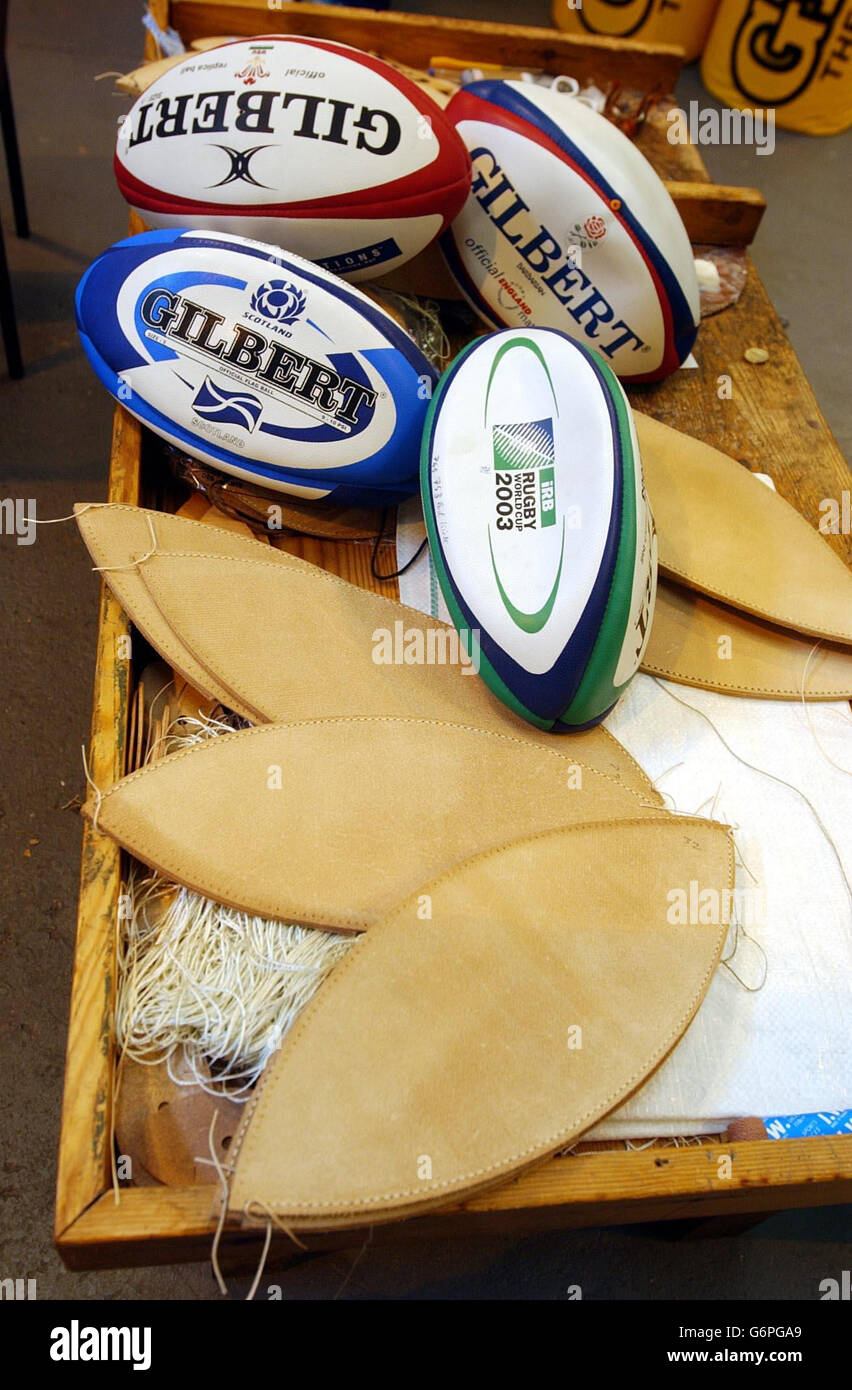 Traditional match rugby balls under construction in much the same way as  the balls have been made at the Gilbert works in Rugby, Warwickshire, since  William Gilbert started their manufacture early in