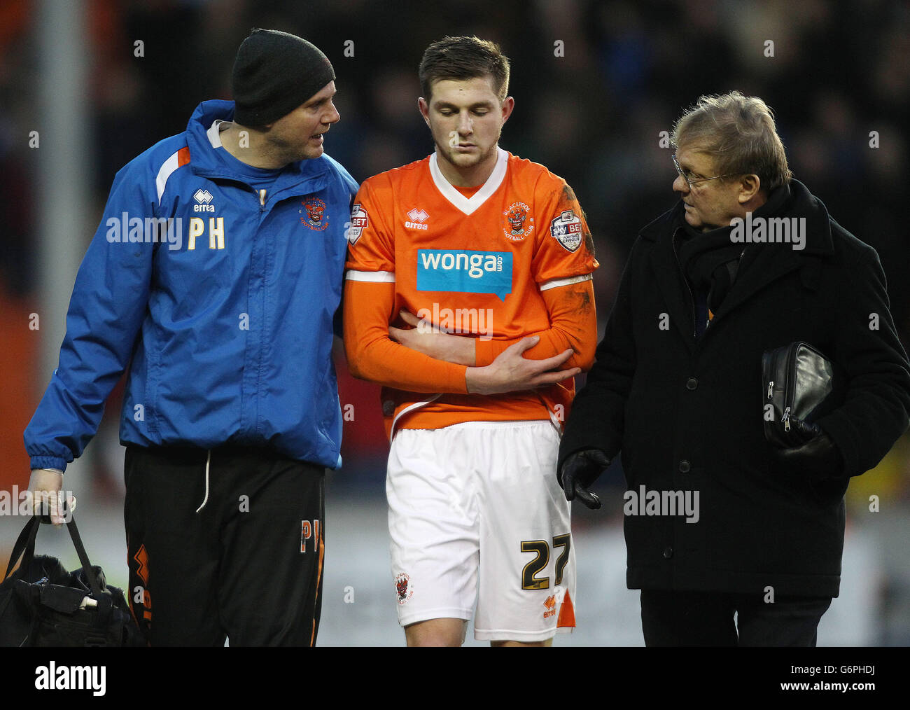 Blackpool's Tom Barkhuizen leaves the pitch with a suspected broken collar bone during the game against Middlesbrough Stock Photo