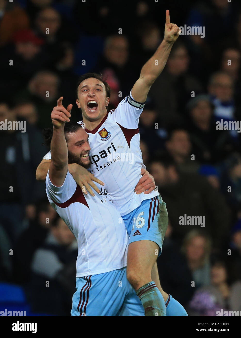 West Ham United's Mark Noble celebrates scoring the second goal with Andy Carroll during the Barclays Premier League match at Cardiff City Stadium, Cardiff. PRESS ASSOCIATION Photo. Picture date: Saturday January 11, 2014. See PA Story SOCCER Cardiff. Photo credit should read: Nick Potts/PA Wire. Maximum 45 images during a match. No video emulation or promotion as 'live'. No use in games, competitions, merchandise, betting or single club/player services. No use with unofficial audio, video, data, fixtures or club/league logos. Stock Photo