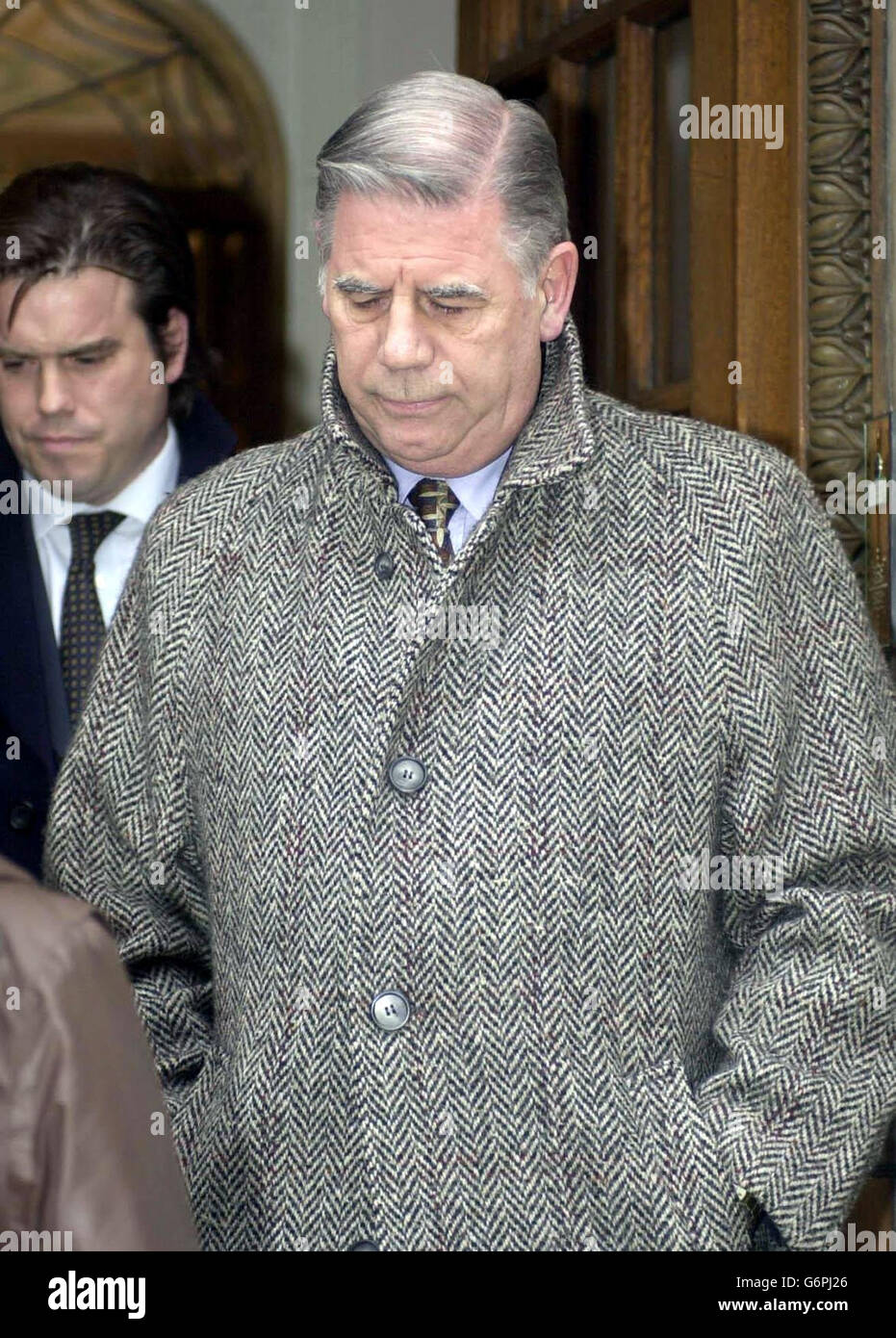 Consultant urologist John Gethin Roberts leaves the General Medical Council, in London, where he faces charges of serious professional misconduct. Graham Reeves, a Korean War veteran, died five weeks after an operation in which the wrong kidney was removed. Stock Photo