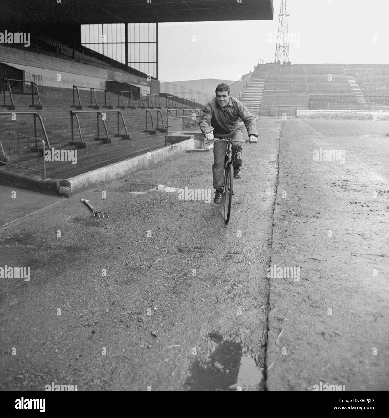 Leeds United and Scotland international Bobby Collins in training on a bike at Elland Road. He had suffered a broken leg at the beginning of the season and cycling helps strengthen leg muscles. Stock Photo