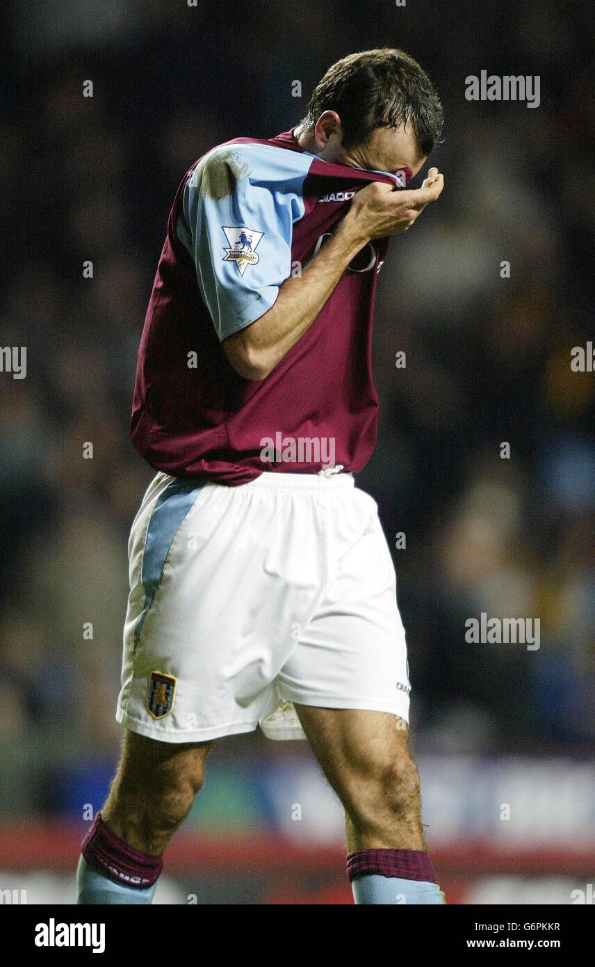 Aston Villa's Gavin McCann takes the long walk back to the changing rooms after being sent off during their Carling Cup semi-final 2nd leg match against Bolton at Villa Park, Birmingham. Stock Photo