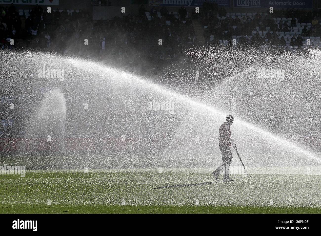 Soccer - Barclays Premier League - Swansea City v Tottenham Hotspur - Liberty Stadium. A groundsman tends to the pitch before the game Stock Photo