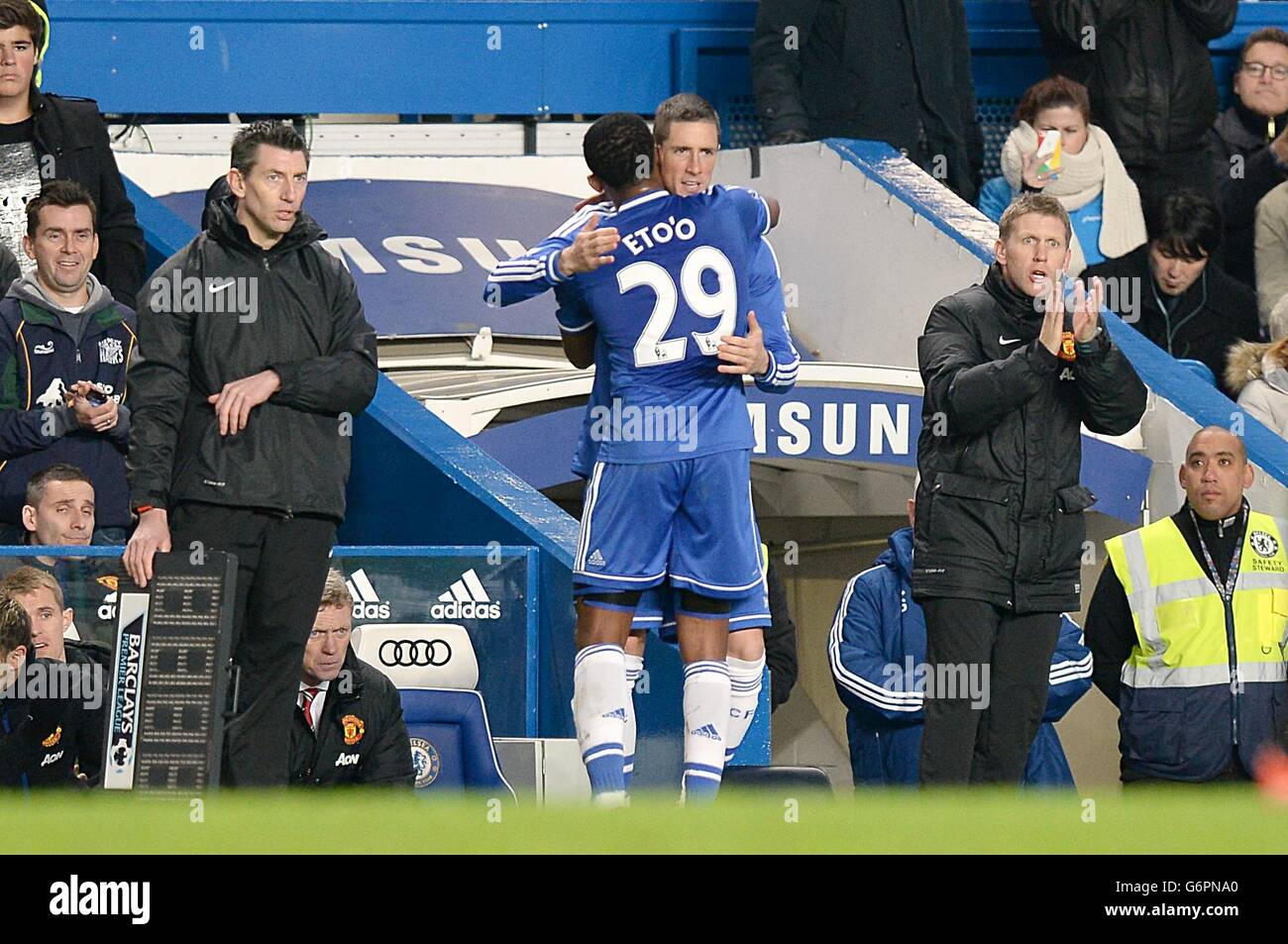 Chelsea's Samuel Eto'o gets a hug from teammate Fernando Torres