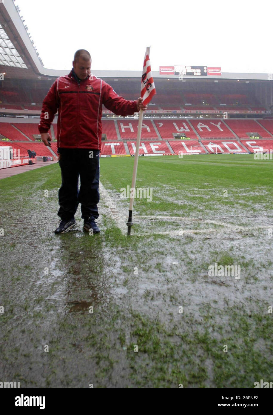 A groundsman takes away the corner flag after Sunderland's Nationwide