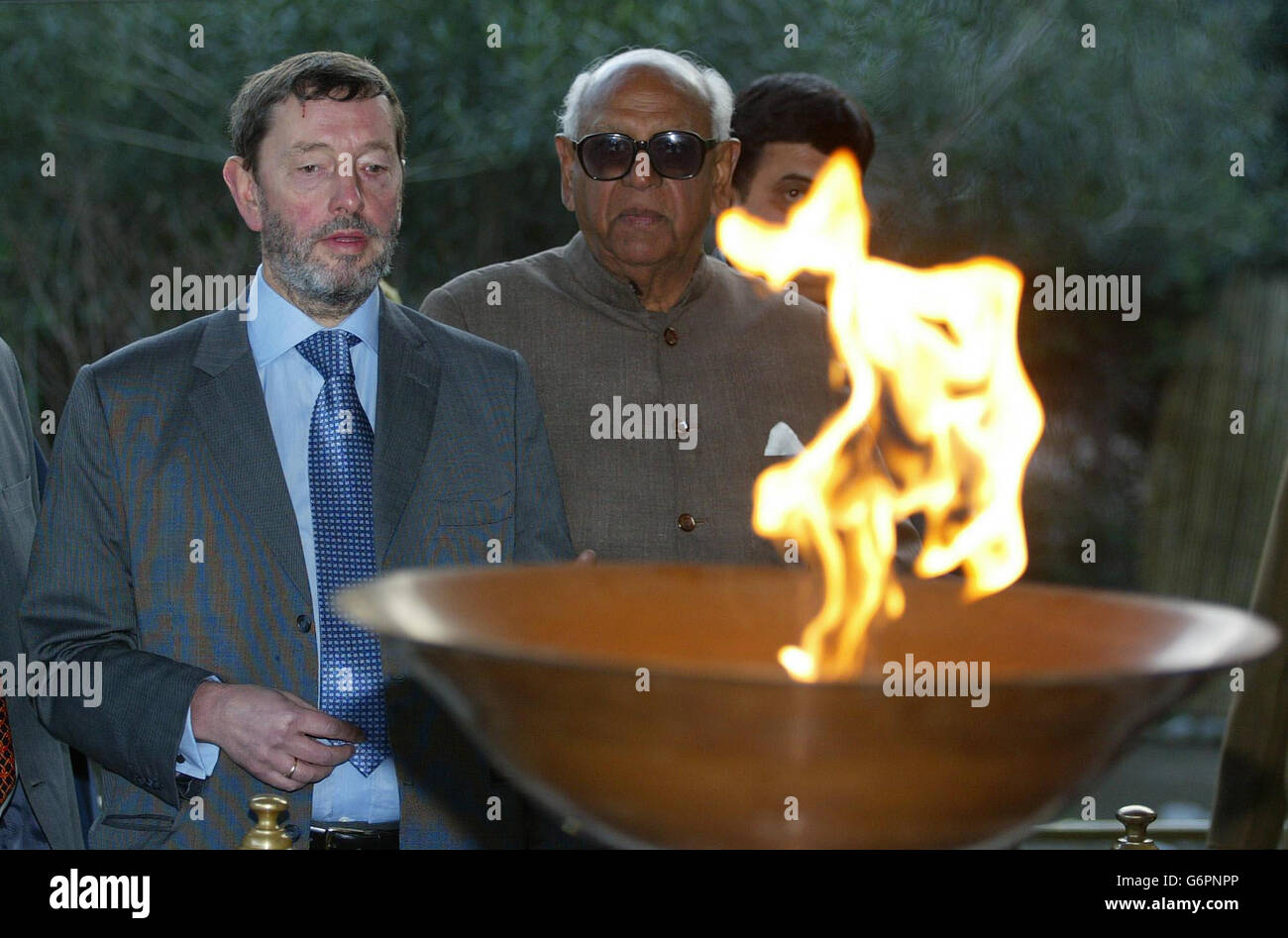 Home Secretary David Blunkett is shown the memorial at Jallianwala Bag in Amritsar. by local member of parliament RL Bhatia. He also visited the nearby Golden Temple in India's Punjab region. The temple is the main Sikh holy site but open to all religions and the scene of a bloody battle in 1984 in which hundreds of Sikhs died. Stock Photo