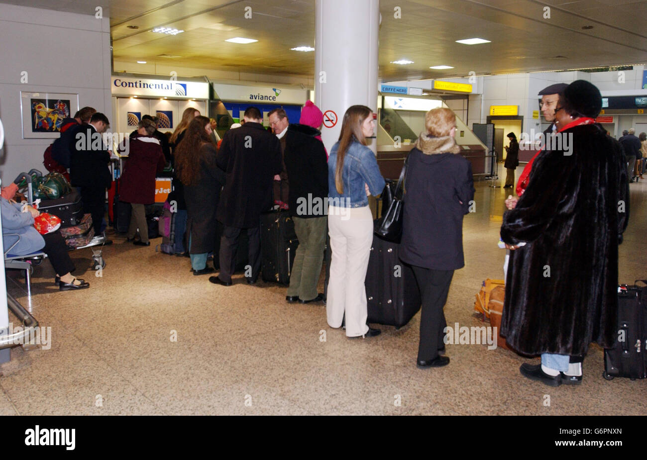 Passengers at Glasgow airport, after their Continental Airlines flight from Glasgow to Los Angeles was cancelled due to a security alert. Stock Photo