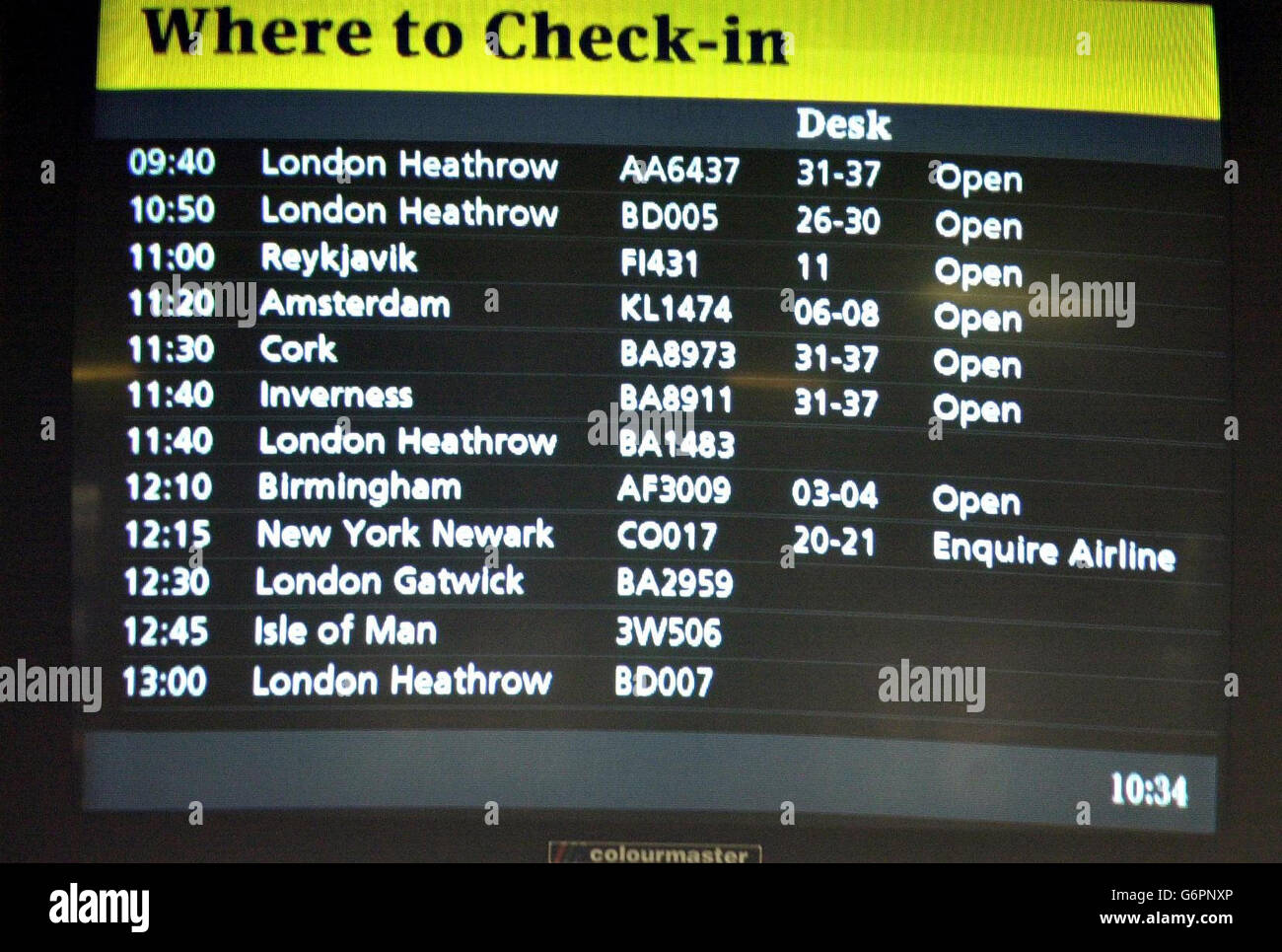 A check-in board at Glasgow Airport highlights problems with flight CO017 to New York Newark. Passengers were redirected via other airlines flying out of other British airports. Stock Photo