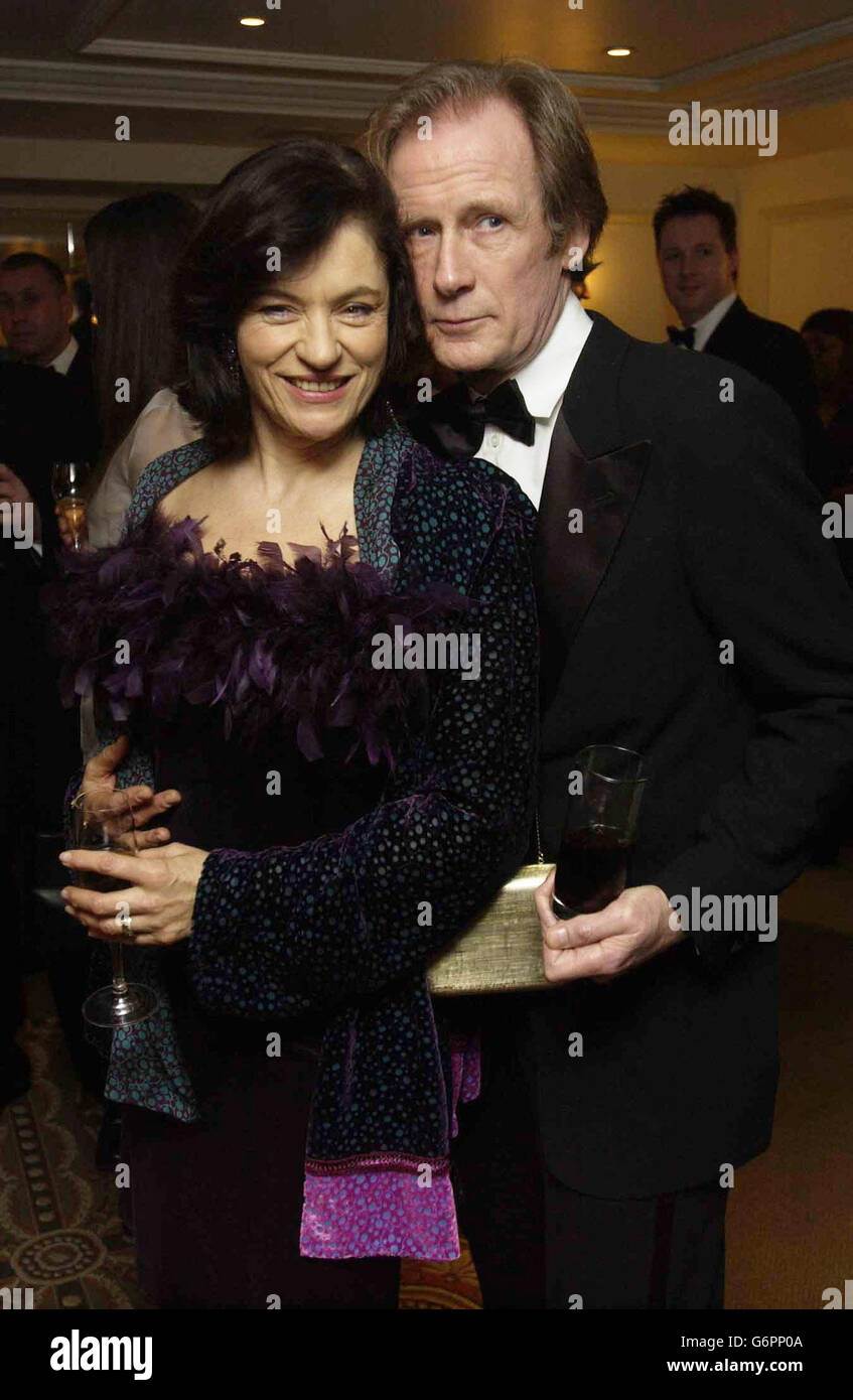 Actor Bill Nighy with his partner Diana Quick attend the Evening Standard Film Awards 2004, at the Savoy Hotel, central London. Stock Photo