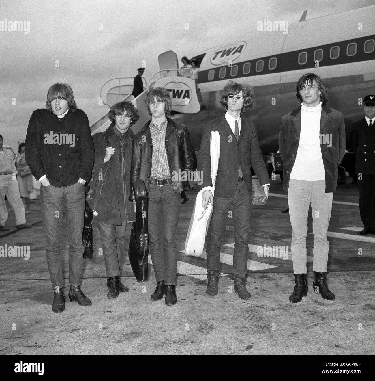 American pop group The Byrds at London Airport, where they flew in for a 16-day tour. (l-r) Mike Clarke, Chris Hillman, David Crosby, Jim McGuinn and Gene Clark. Stock Photo