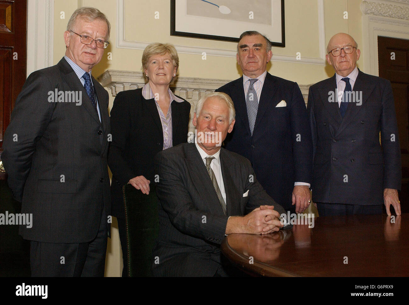 The Committee to Review Intelligence on Weapons of Mass Destruction assemble in London. They are, from left to right, Sir John Chilcot, the Rt Hon Ann Taylor MP for Dewsbury, Committee Chairman, Lord Butler of Brockwell (seated), Michael Mates MP for East Hampshire and Field Marshal Lord Inge. 13/07/2004 Ministers were, Tuesday July 13, 2004, receiving the final version of Lord Butler's report into the use of intelligence in the Iraq war. There is intense speculation that the former Cabinet Secretary's inquiry team will be highly critical of the role played by Britain's intelligence agencies Stock Photo