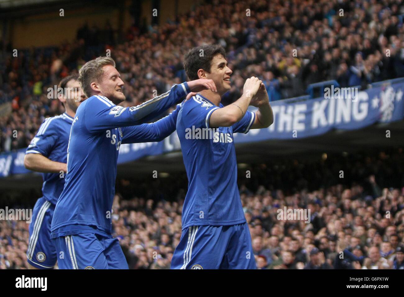 Chelsea's Emboaba Oscar celebrates scoring their first goal of the game with team0mate Andre Schurrle (left) Stock Photo