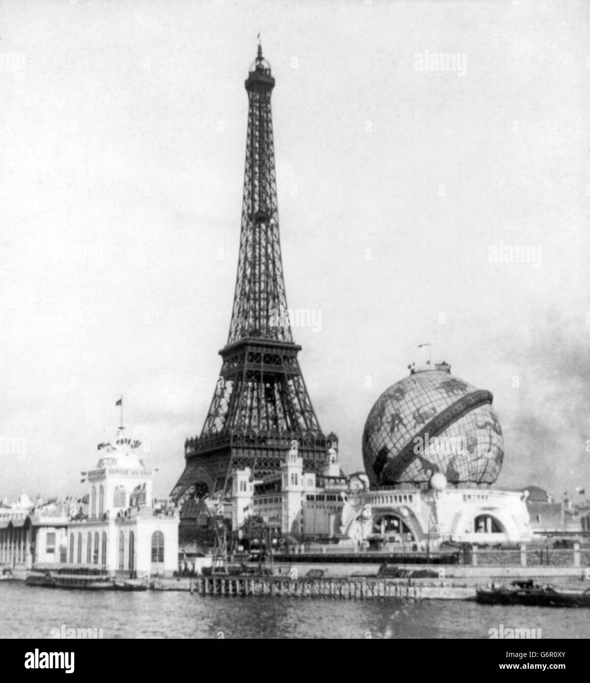 Paris Exposition, 1900. Eiffel Tower, River Seine and globe from Point Passay, Paris Exposition 1900, Paris, France. The Eiffel Tower was built to serve as the entrance to the Exposition Universelle in 1889. Stock Photo