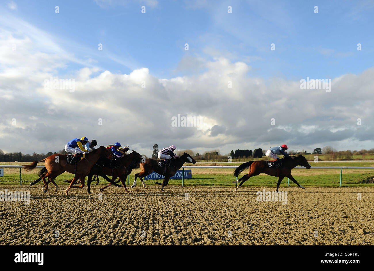 Roy's Legacy ridden by Adam Kirby leads in the final straight during the Compare Bookmakers at bookmakers.co.uk at Lingfield Park Racecourse, Surrey. Stock Photo
