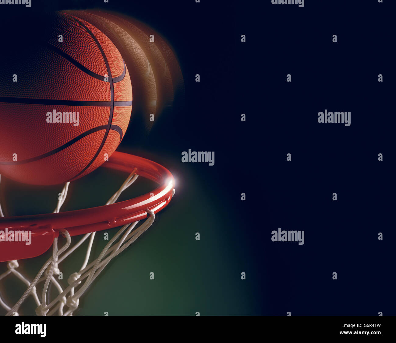 Basketball ball through hoop isolated hires stock photography and