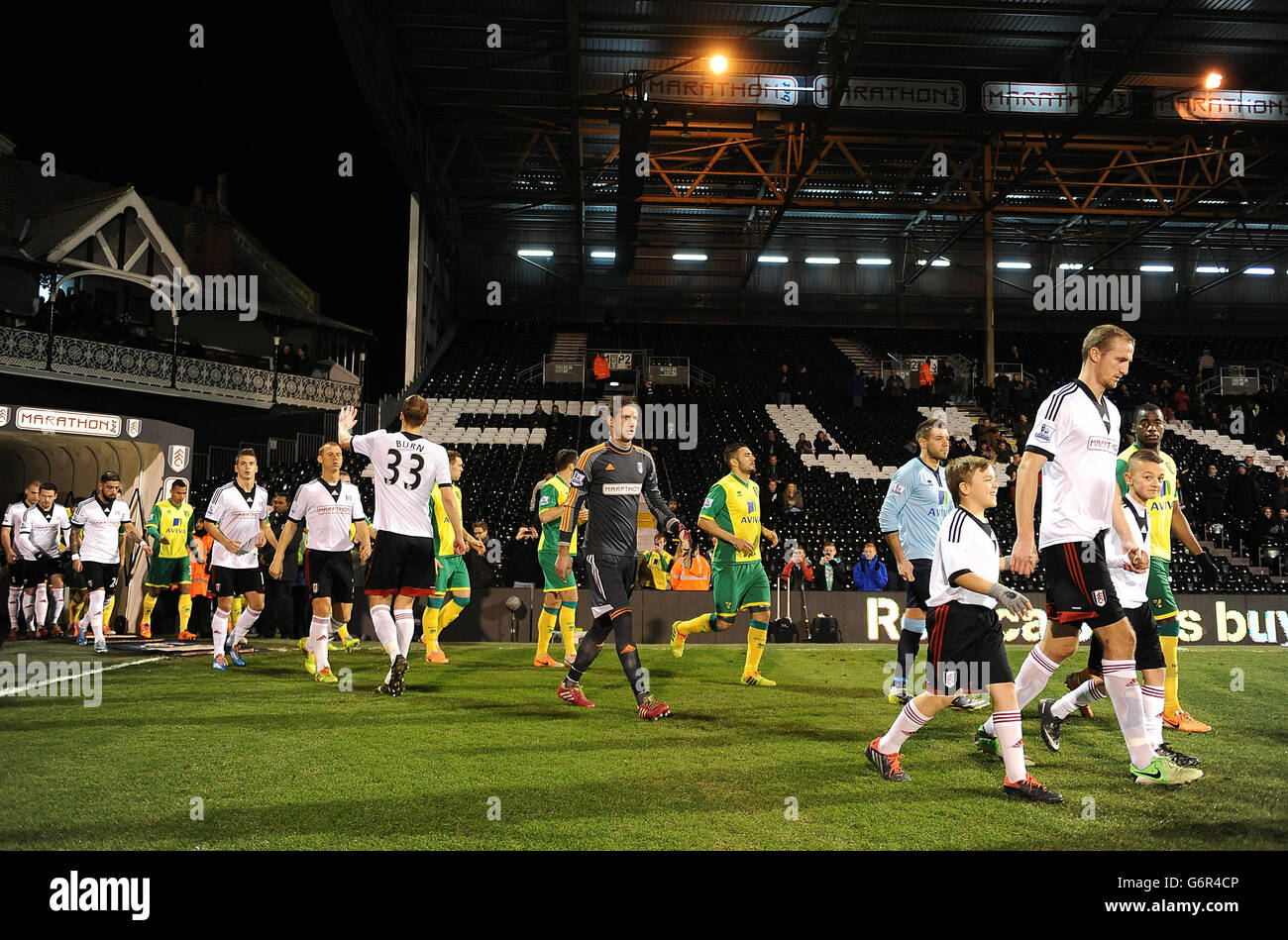 Players from both teams walk out on to the pitch before kickoff Stock Photo Alamy