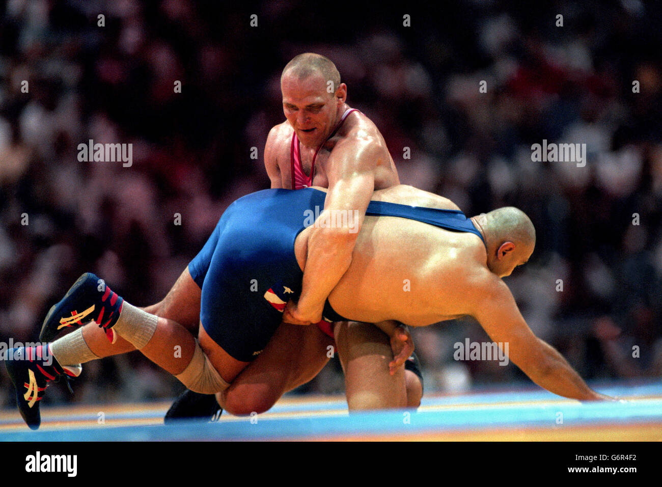 23 July 1996. Atlanta Olympic Games. Greco-Roman Wrestling 130Kg .Alexander Karelin, Russia, gets to grips with Siamak Ghaffari, USA Stock Photo