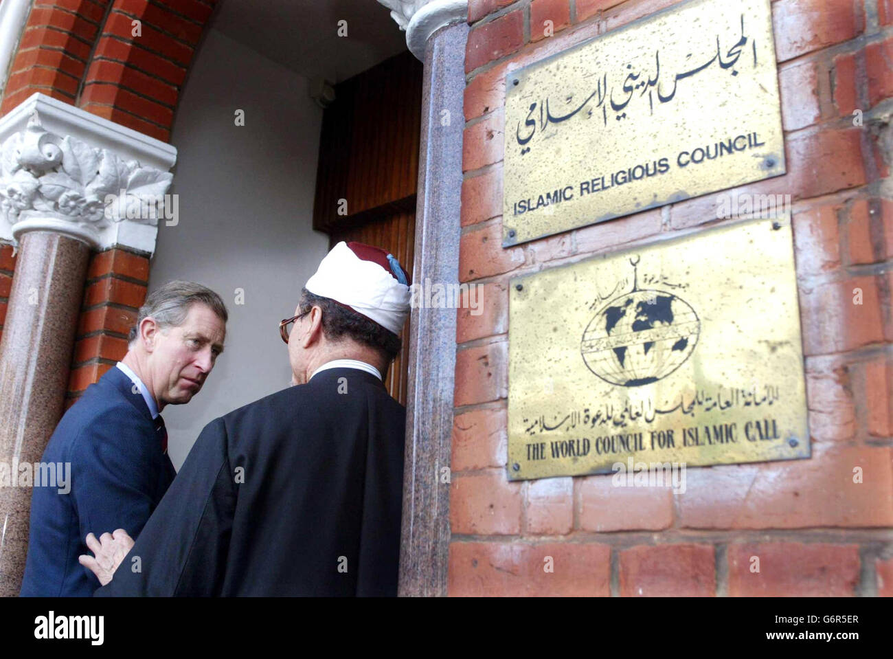 The Prince Of Wales arrives at the Muslim College in Ealing, West London, where he took part in a debate on the problems of Muslim extremism and called for greater understanding of the Islamic faith. He is greeted on arrival by college principle Dr Zaki Badawi who described the prince as the 'most popular world leader to Muslims everywhere'. Stock Photo