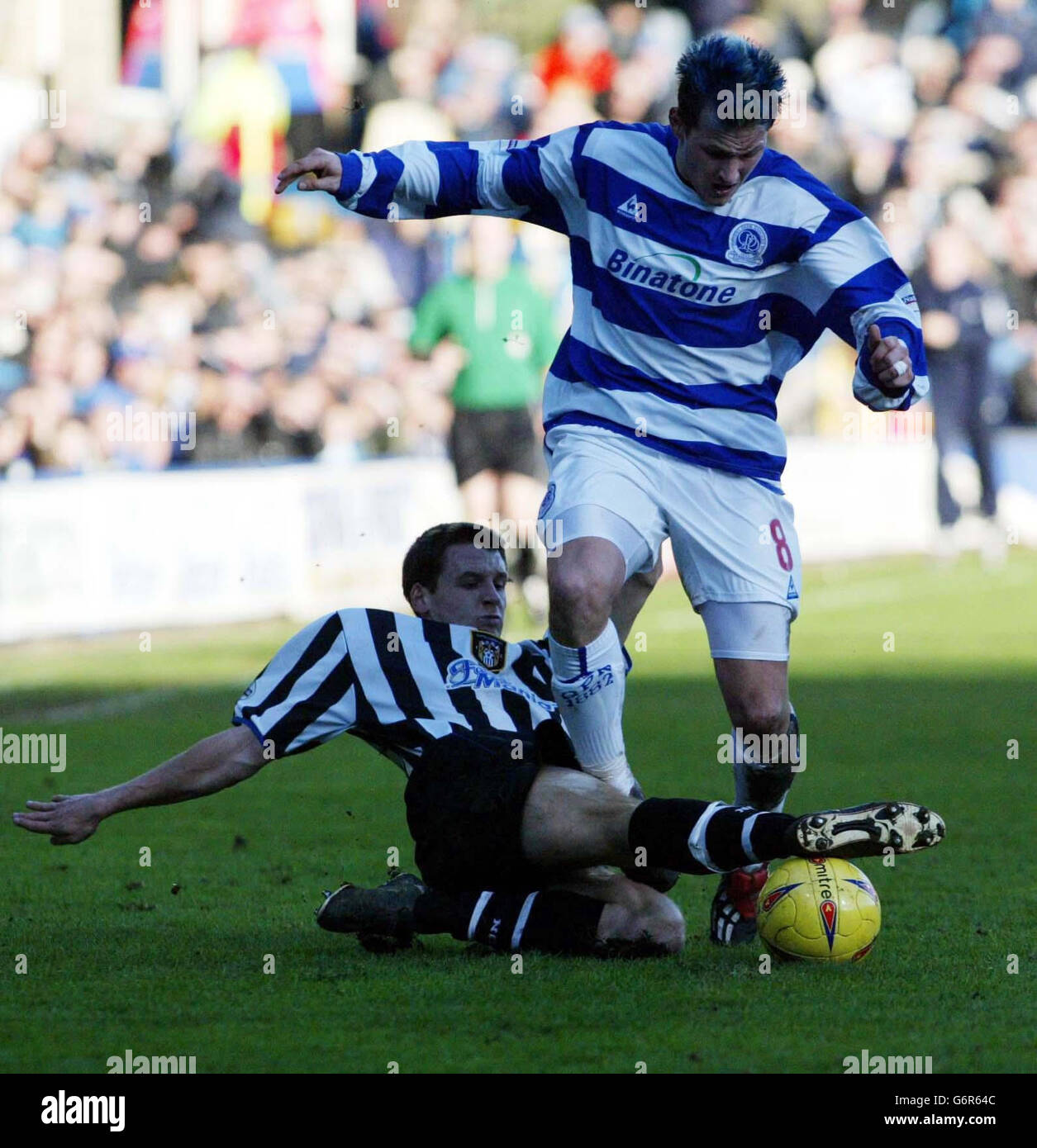 Notts County's Paul boertien (L) challenges QPR's Marc Bircham during the Nationwide Division Two match at Loftus Road, west London, Saturday 7 February, 2004. PA Photo: Mark Lees. . Stock Photo