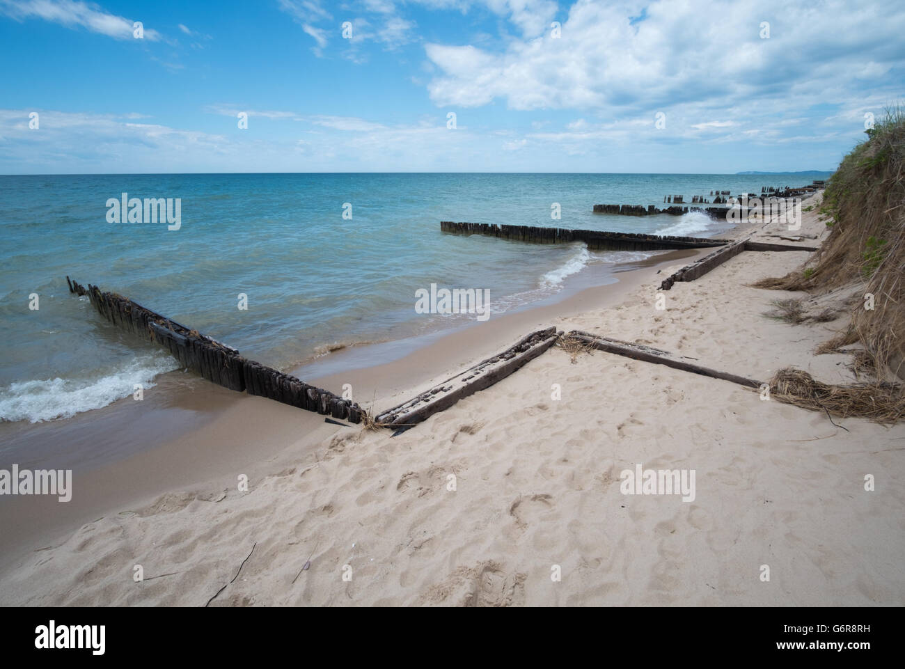 Remains of a shipping dock left over from the lumbering days of the early 1900s on the shore of Lake Michigan Stock Photo