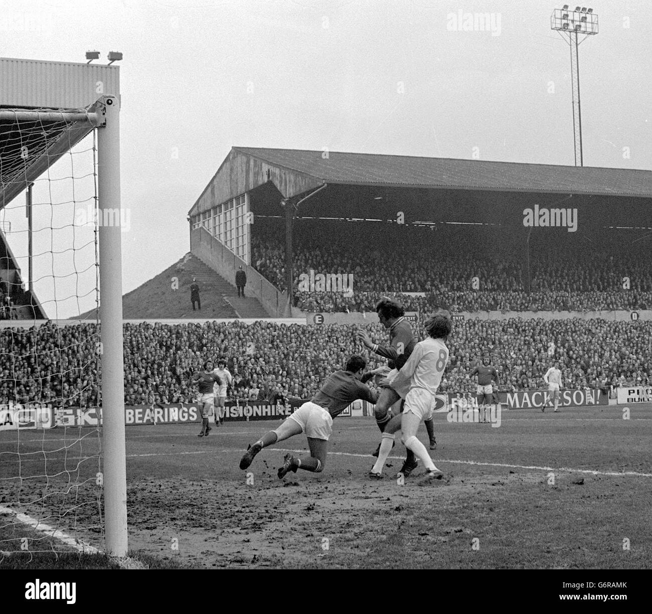 Bristol City goalkeeper Raymond Cashley saves from Leeds Utd's Allan Clarke (No8) assisted by Gerald Sweeney, during the FA Cup 5th round replay at Elland Road, Leeds. Stock Photo