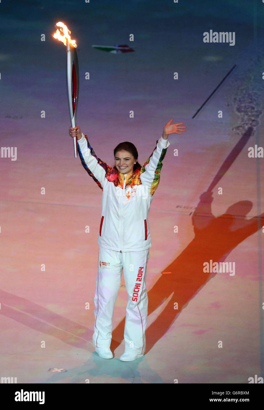 Russian gymnast Alina Kabaeva holds the torch during the Opening Ceremony for the 2014 Sochi Olympic Games at the Fisht Olympic Stadium, near Sochi, Russia. Stock Photo