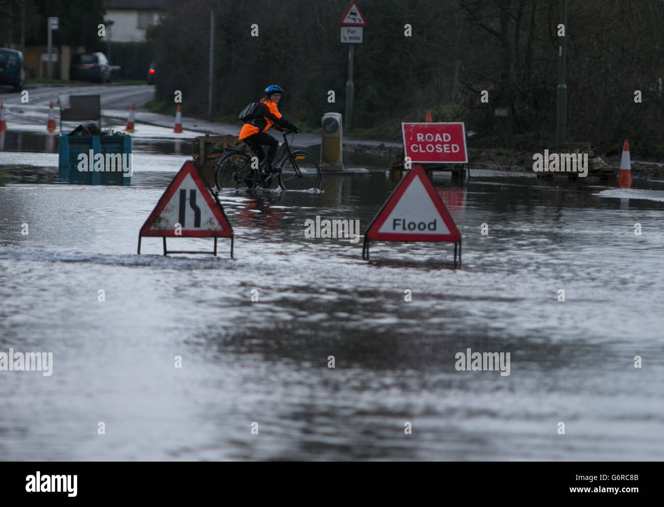 A flooded road near Chertsey in Surrey as large swathes of England and Wales are on flood alert today as yet another storm with winds of up to 70mph arrives in Britain. Stock Photo