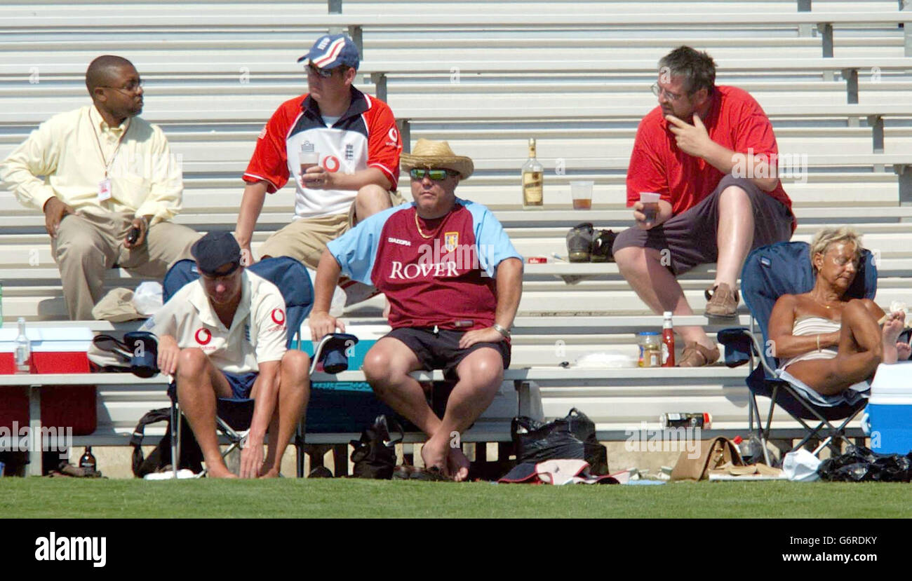 England cricket fans watch their team in the field, during the second day of the first tour