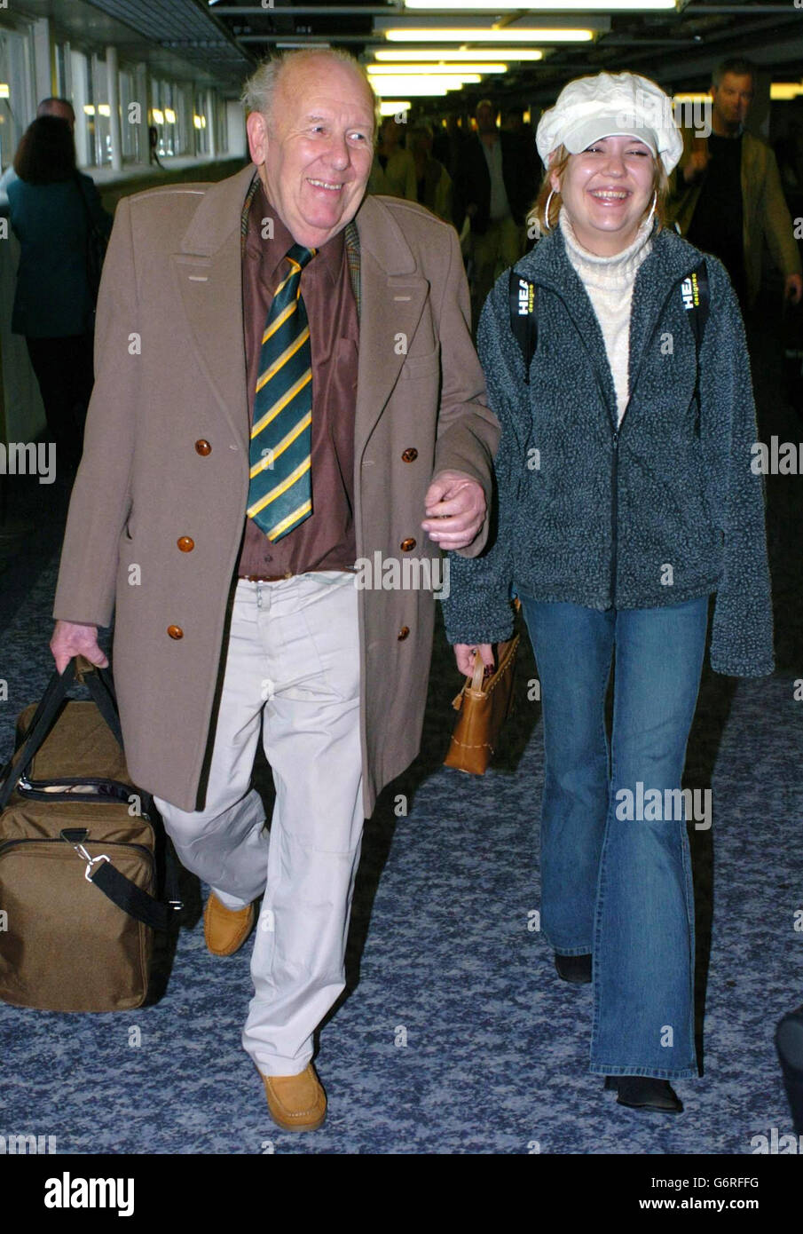 Samantha Marson, a student who jokingly claimed she was carrying a bomb in her bag as she prepared to board a flight in the US, is accompanied by her father Jim as she arrives back at Heathrow Airport. The 21-year-old was able to secure her freedom by agreeing to pay 550 to a fund for the victims of the September 11 terrorist atrocities and writing a letter of apology. Stock Photo