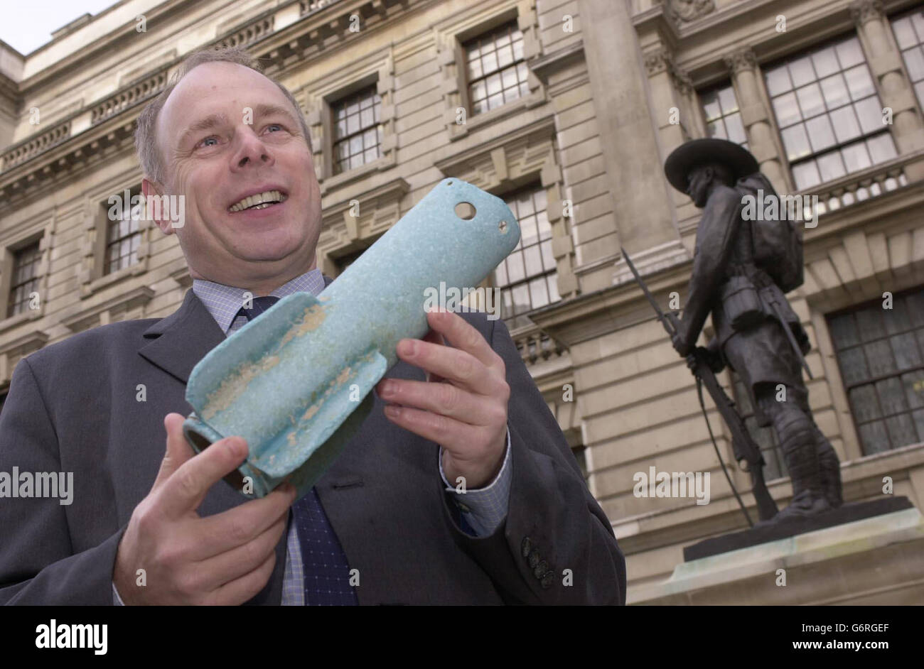 Conservative MP Ian Liddell- Grainger holds aloft one of two missile-casings found washed ashore on the Weston-Super-Mare coastline, outside the Old War Office in central London. Mr Liddell-Grainger, who was returning the blue fibre-glass tail-fins to the MoD, today accused the ministry of a "catalogue of failures" in allowing a pallet load of missiles to be lost during a routine underwater disposal exercise which went wrong in March 2002. Stock Photo