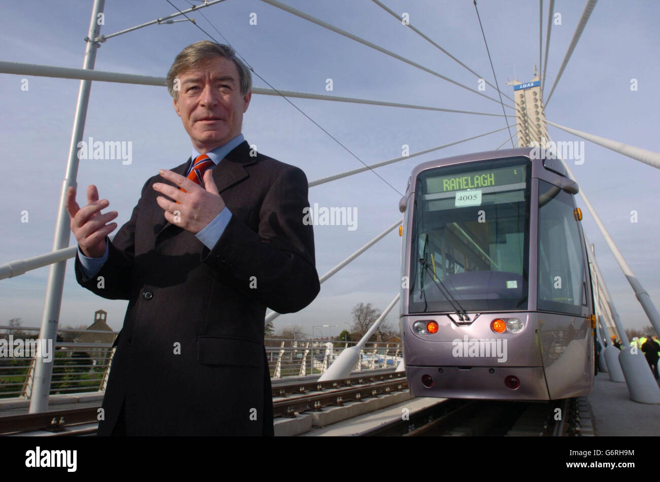 Minister for Transport, Seamus O'Brennan, celebrates the reopening of