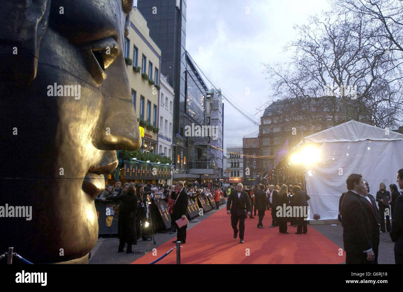 Crowds and press gather outside the Odeon Leicester Square in London ahead of the Orange British Academy Film Awards. Stock Photo