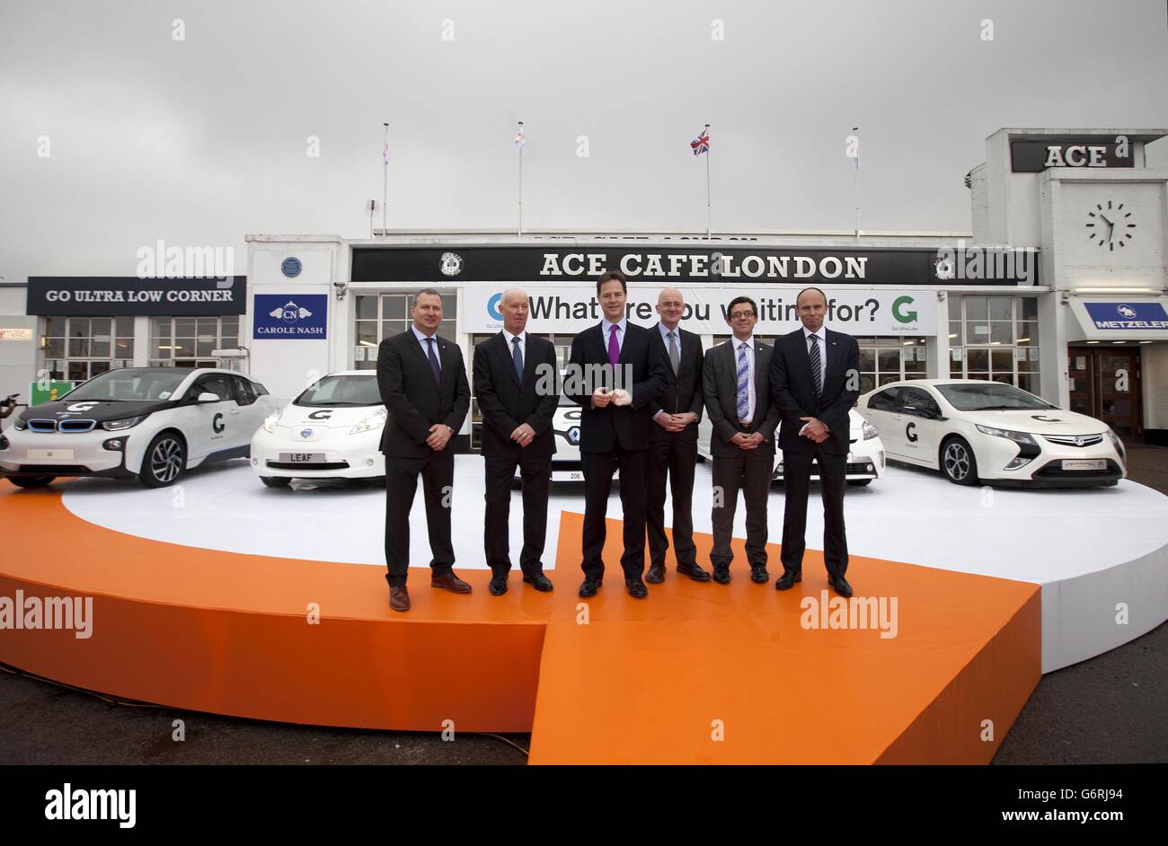 Deputy Prime Minister Nick Clegg (third left) with, from first left, Kenneth Ramirez UK Managing Director of Renault, Tim Abbott UK Managing Director of BMW, Jim Wright UK Managing Director of Nissan, James Taylor Fleet Director of Vauxhall and Matt Harrison President and Managing Director of Toyota, during a visit to the Ace Cafe in Stonebridge, northwest London, for the launch of the Go Ultra Low campaign. Stock Photo