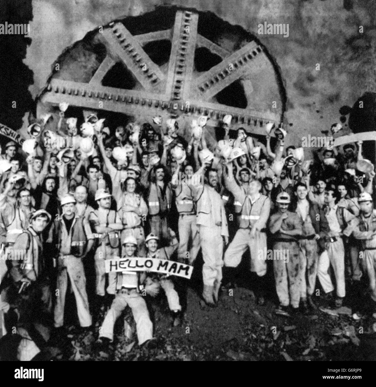 Cheering Channel Tunnel construction workers celebrated a major breakthrough when an 800 tonne tunnel boring machine emerged at Holywell, near the Folkestone terminal site, after a 13-month, five-mile drive from the tunnel construction site at Shakespeare Cliff, near Dover. Stock Photo