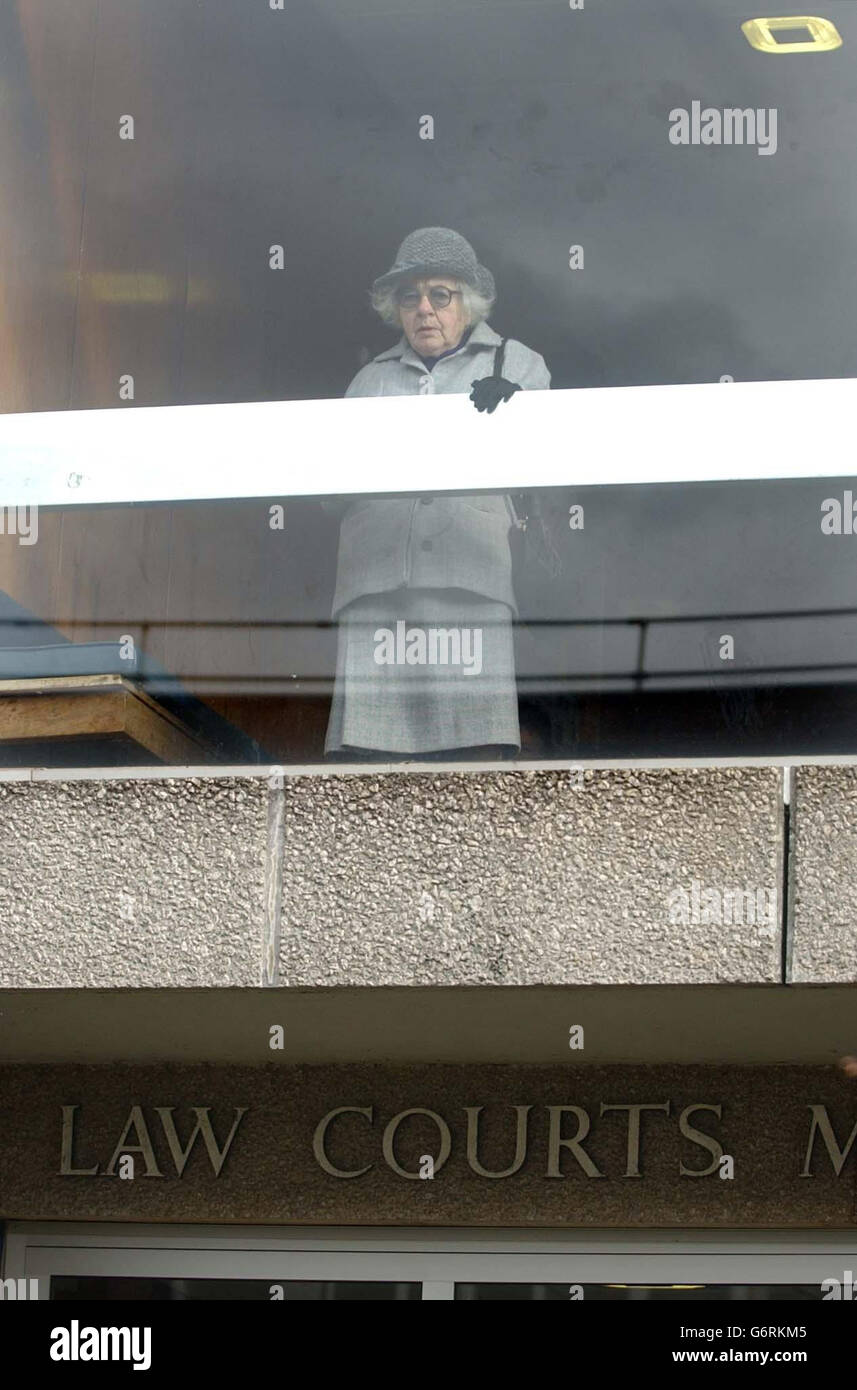 Eighty-three-year-old pensioner Elizabeth Winkfield looks out of a window at Barnstaple Magistrates Court in Devon where she said she was prepared to go to jail rather than comply with a liability order made by the court, for non-payment of some of her council tax. Wearing a hat she bought in a jumble sale and a suit she made herself, Miss Winkfield, who lives alone on a bungalow at Westward Ho!, admitted in court she had no defence to failing to pay 98.80 of the 747.812 tax on her band C home. Stock Photo