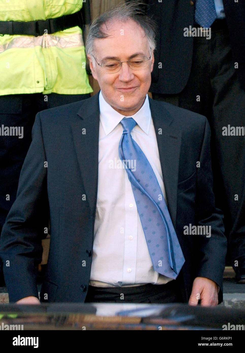 Conservative Party Leader Michael Howard looks wind swept during a visit to the One-Stop Shop in Burnley, Lancashire. In a speech delivered in the Lancashire town where the BNP has seven councillors, Mr Howard said the party's message of 'racism and brutality' flew in the face of Britain's political traditions. Stock Photo