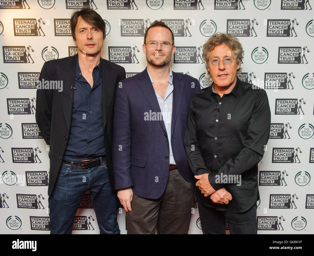 Director of Brand and Values at The Body Shop Sam Thomson (centre) with Brett Anderson of Suede (left), and Roger Daltry of The Who at a press conference at the Groucho Club, in Soho, central London, to announce the line up for the Teenage Cancer Trust concerts 2014. Stock Photo