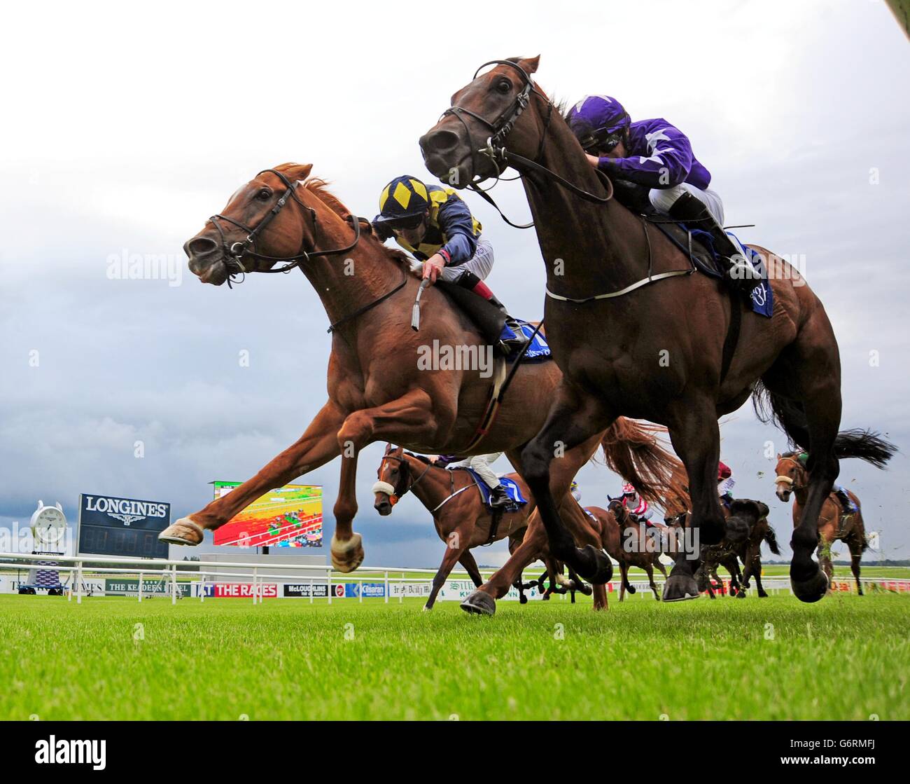 Rattling Jewel ridden by Wayne Lordan (right) win the RTE Radio One  Handicap from In Salutem ridden by Pat Smullen (left) during day one of the  Dubai Duty Free Irish Derby Festival
