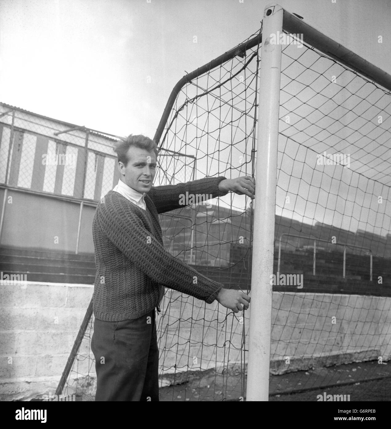 Yeovil Town FC's part-time groundsman and inside-right, Terry Foley. He is seen here getting the Yeovil ground - famous for its 10ft slope - ready for the team to meet Second Division Bury in the third round of the FA Cup on Saturday. During a previous successful cup run, Yeovil beat Bury 3-1 in January 1949. Stock Photo