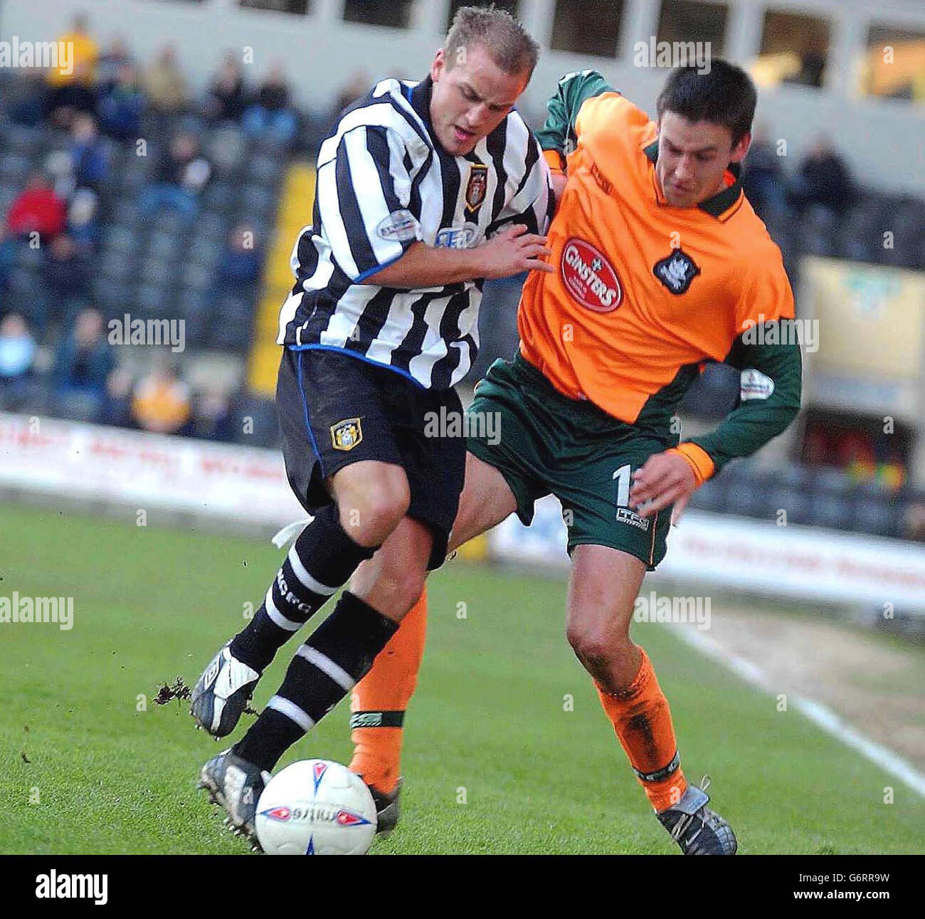 Notts County's David Pipe is tackled by Plymouth's Ian Stonebridge, during the Nationwide Division Two match at the County Ground, Nottingham, Saturday March 6, 2004. NO UNOFFICIAL CLUB WEBSITE USE. Stock Photo