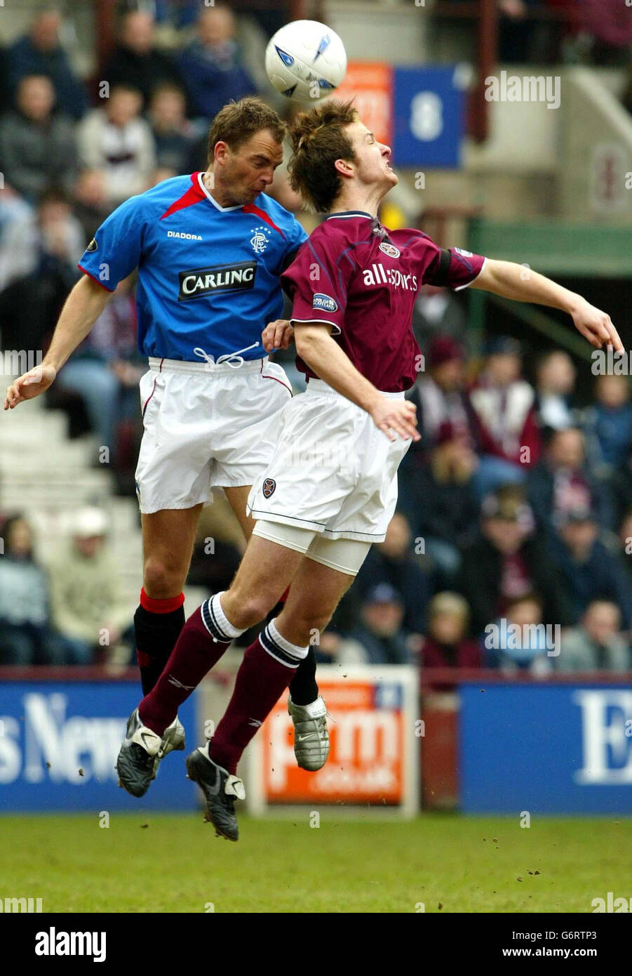 Glasgow Ranger's Frank De Boer (left) in action with Andrew Webster of Hearts, during the Nationwide Division Three match at Tynecastle Stadium, Edinburgh. Stock Photo