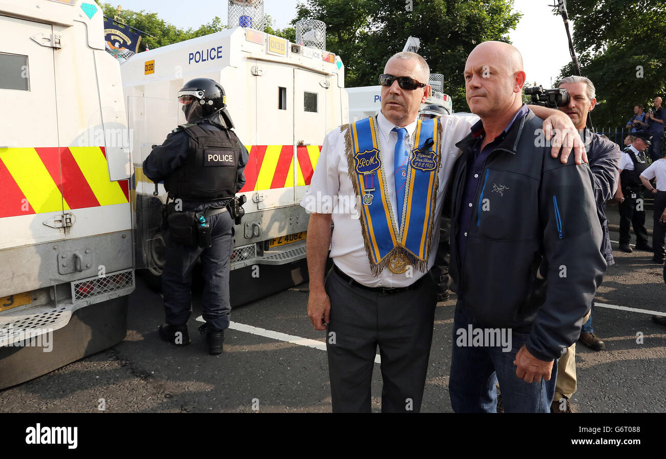 12/07/2013, Ross Kemp (right) photographed with a Orangeman during filming of his television documentary Extreme World during sectarian riots in north Belfast. Stock Photo